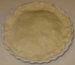 Fold the edges of the crust under and flute the edges of the pie.