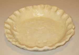 unbaked pie shell showing fluted edges