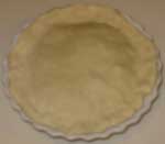 Fold the edges of the crust under and flute the edges of the pie.